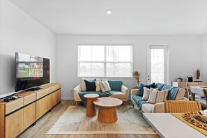 Living room with modern furniture and comfortable sofas.