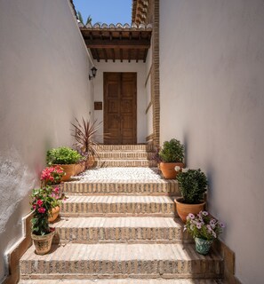 Walk up to exit to the cobblestone street of Granada!
