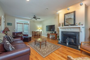 Main level living room with gas logs and large smart TV (requires renters logins).