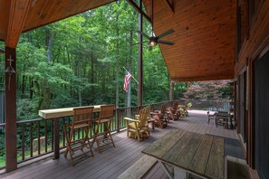 Spend your afternoons on the wraparound porch listening to the creek and wind rustling through the pines.