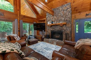Cozy up in the living room around the wood-burning fireplace while watching your favorite movies on the smart TV (streaming only).