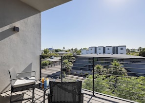 2nd Floor: Primary Bedroom private balcony with outdoor furnishings.