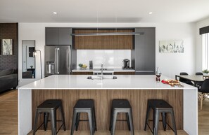 1st Floor: Fully equipped modern kitchen completely stocked with all culinary essentials and includes high-end Cafe stainless steel appliances.