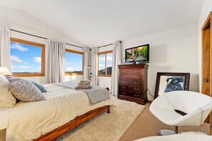 The master bedroom is large, comfy, and has incredible mountain views