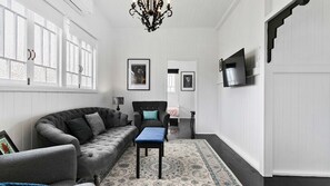Indulge in the serenity of our inviting living room, designed for ultimate relaxation. Sink into plush furnishings, bask in the natural light streaming through large windows, and let the soothing ambiance create a perfect retreat for you and your loved on