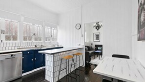 Step into our immaculate kitchen and dining area, where cleanliness meets functionality. This well-appointed space is equipped with modern appliances, spotless surfaces, and ample seating, ensuring a pristine environment for preparing and enjoying delicio