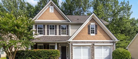Front view with parking available on the driveway and in the garage.