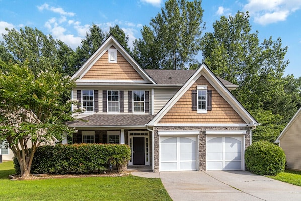Front view with parking available on the driveway and in the garage.