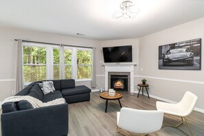 Stunning view of the living room with a Smart TV, and queen sofa bed for extra sleeping