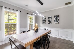 Open-concept kitchen with view to the living room and dining area