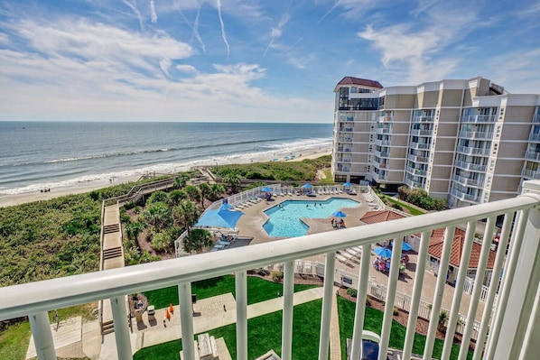Wake up to sweeping ocean views and unwind with front-row access to the beach and pool right from your private balcony.