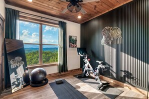 Enjoy a private gym with an unmatched view. Peloton, hand weights,  yoga mat and a few more accessories.