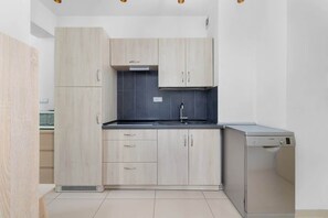 Kitchen with a microwave.