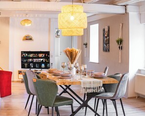 Enjoy a cozy evening with your loved ones around our big table with comfy chairs