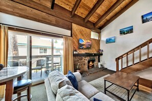 Enjoy wood accents and vaulted ceilings while taking in the balcony views