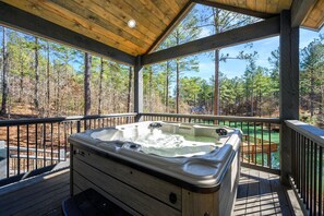 Experience the ultimate relaxation in our hot tub, which overlooks a private pond