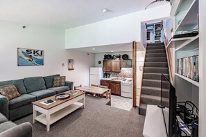 Living room/stairs to upper level bedroom