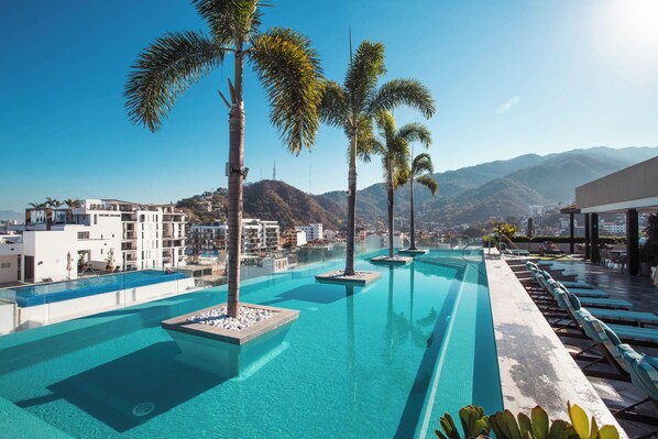 Rooftop inifinity pool with scenic views