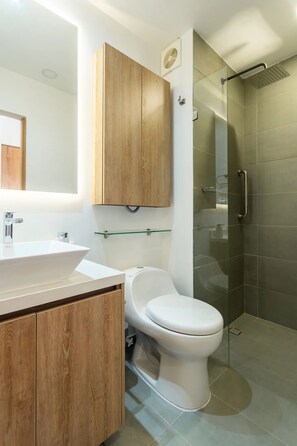 Full standing shower with hot water and hand rails for extra safety