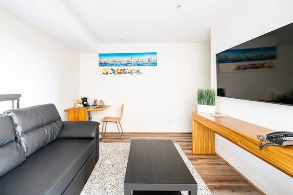 The light-filled living area offers a comfortable space to settle in with a movie, while split system air conditioning ensures year-round comfort.