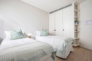 Two king-single beds and built-in wardrobes within the second bedroom cater to groups or those travelling with kids. The beds can be pushed together into a king upon request.
