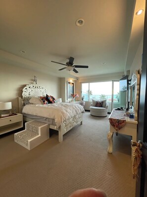 First bedroom with queen bed and extra linens.