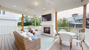 main level outside living space with gas fireplace