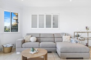 Sink into comfort in our spacious living area, perfect for lounging and unwinding. Beach towels are provided for your seaside adventures!