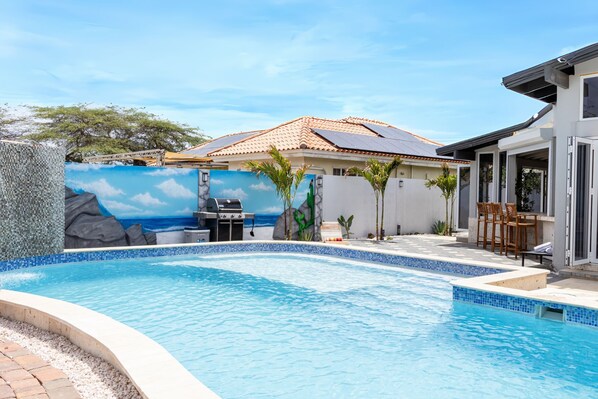 Relax by the pool with BBQ area