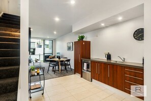 Kitchen and staircase to bedrooms