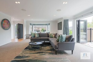 Beautifully appointed open plan lounge with gas fireplace