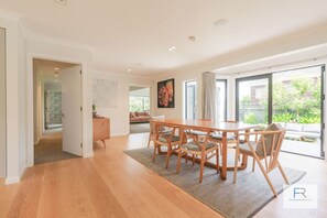 Open plan dining area leading onto side garden