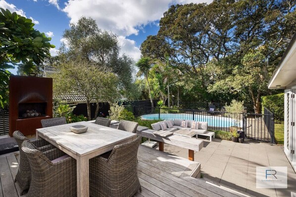 Poolside dining and outdoor lounge area