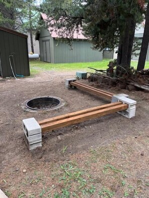 Firepit with seating located outside.