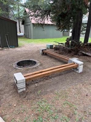 Firepit with seating located outside.