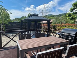 The BBQ gas stove on the wooden deck is available for rental.