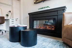 Enjoy the cozy fireplace in the master bedroom suite.