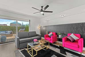 Welcome to the heart of our stylish retreat! Our living room exudes comfort and modern charm, featuring plush furnishings and contemporary decor. 
