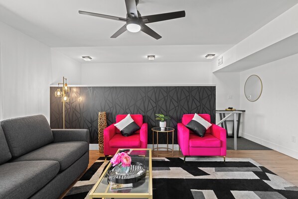Welcome to the heart of our stylish retreat! Our living room exudes comfort and modern charm, featuring plush furnishings and contemporary decor. 