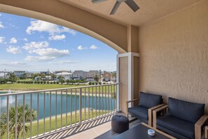 Private Covered Balcony Complete with Comfortable Seating and Serene Views