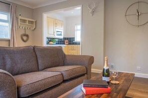 open space kitchen, dining, and living area