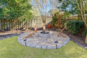 Transform your evenings into cozy gatherings by our backyard fire pit.