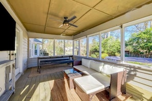 Escape to our back porch retreat, a private space with seating for 10