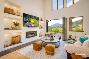 Ample living room with TV and gas fireplace