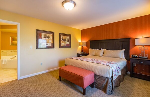 Bedroom with king bed and ensuite bathroom.