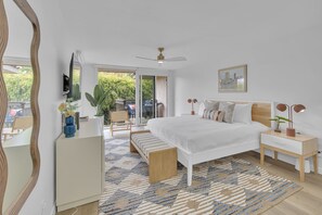 Master bedroom: king bed, smart TV, ensuite bathroom, small private balcony with BBQ grill, walk-in closet