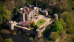 the Castle in its garden setting. Castle Turrets are on the corners 