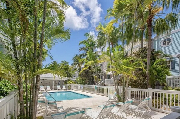 Relaxing by the shared pool at Castaway Cove, you can unwind under the swaying palms and soak up the serene ambiance of Key West.