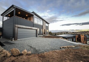 External structure, dual car garage, driveway (concrete + gravel)