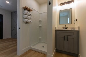 Step into the newly designed bathroom, equipped with all the essentials for a relaxing and convenient stay. From high-quality shampoo and conditioner to soap, lotion, and plush towels, we've taken care of every detail to ensure your comfort and refreshmen